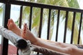 Closeup shot of a person's feet while resting on a hammock near the beach Royalty Free Stock Photo