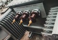 Closeup shot of 3-phase distribution transformer Bushings with porcelain insulator Royalty Free Stock Photo