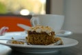 Closeup shot of a piece of a delicious carrot cake with a blurry background Royalty Free Stock Photo