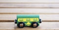 Closeup shot of a piece of a wooden miniature train on a table