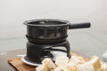 Closeup shot of pieces of bread and a cooker on a small gas stove Royalty Free Stock Photo