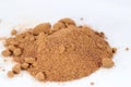 Closeup shot of a pile of brown sugar on a white surface