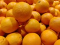 Closeup shot of a pile of fresh oranges displayed in a store Royalty Free Stock Photo
