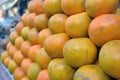 Closeup shot of a pile of fresh oranges in a market place Royalty Free Stock Photo