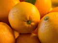 Closeup shot of a pile of fresh oranges placed under the sunlight Royalty Free Stock Photo