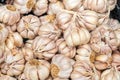 Closeup shot of a pile of garlic at a farmer market sale Royalty Free Stock Photo