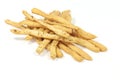Closeup shot of a pile of homemade breadsticks on a white surface