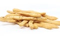 Closeup shot of a pile of homemade breadsticks on a white surface