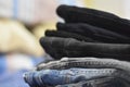 Closeup shot of a pile of jeans in different colors