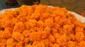 Closeup shot of a pile of orange marigold flower heads