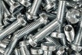 Closeup shot of a pile of silver industrial bolts Royalty Free Stock Photo