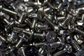 Closeup shot of a pile of silver screws and bolts