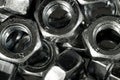 Closeup shot of a pile of stainless silver industrial nuts