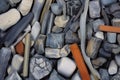 A closeup shot of a pile of stones with a cigarette in the middle