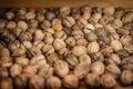 Closeup shot of a pile of walnut on a wooden surface