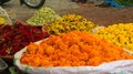 Closeup shot of piles of colorful marigold flower heads