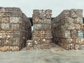 Closeup shot of piles of pressed waste paper bales in the yard, waste paper recycling concept