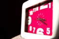 Closeup shot of a pink clock with white frames Royalty Free Stock Photo