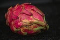 Closeup shot of the pitaya fruit in a dark background Royalty Free Stock Photo