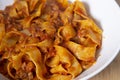 Closeup shot of the plate of Bolognese pasta. Mediterranean food with meat