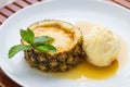 Closeup shot of a plate with ice cream and diced pineapples Royalty Free Stock Photo