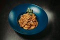 Closeup shot of a plate of macaroni in a beef sauce