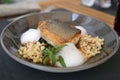 Closeup shot of a plate of salmon with lintels on the side