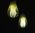 Closeup shot of power electricity bulbs on a black background Royalty Free Stock Photo