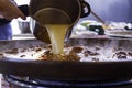 Closeup shot of the preparation of a chicken paella on the gas