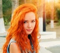 Closeup shot of a pretty red haired women in calm state