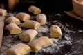 Closeup shot of the process of baking mushroom pastries in a kitchen