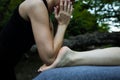 Closeup shot of a professional relaxing feet massage with elbows