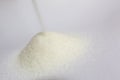 Closeup shot of pure refined sugar on a white background