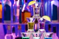Closeup of shot pyramid glasses with limes