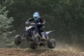 Closeup shot of quad rider in black jumping Royalty Free Stock Photo