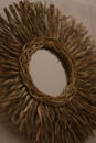 Closeup shot of a raffia mirror - interior inspiration