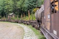 Closeup shot of the railway cars and tracks in the woods Royalty Free Stock Photo