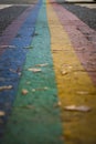 Closeup shot of rainbow colored zebra crossing indicating equal rights for lbgtq community