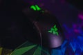 Closeup shot of a Razer gaming mouse with the logo on the colorful background Royalty Free Stock Photo