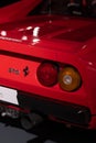 Closeup shot of the rear light of a red Ferrari 288 GTO 1984 at the Ferrari Museum