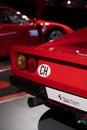 Closeup shot of the rear light of a red Ferrari 288 GTO 1984 at the Ferrari Museum