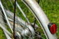 Closeup of a rear wheel of an rusty shabby vintage bicycle.