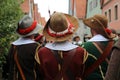 Closeup shot of reconstructors in musketeers clothes on a city holiday. Royalty Free Stock Photo