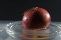 Closeup shot of a red apple with waterdrops Royalty Free Stock Photo