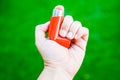 Closeup shot of a red asthma inhaler