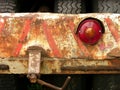 Closeup shot of a red break tail light of a heavy equipment truck Royalty Free Stock Photo