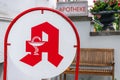 Closeup shot of a red German pharmacy sign at the entrance