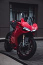 Closeup shot of a red motorcycle Ducati Panigale 1199, parked on the street