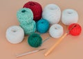 A closeup shot of red, purple, and blue knitting yarns and crochet hooks Royalty Free Stock Photo