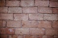 Closeup shot of a red stacked stone wall - perfect for a cool background wallpaper Royalty Free Stock Photo
